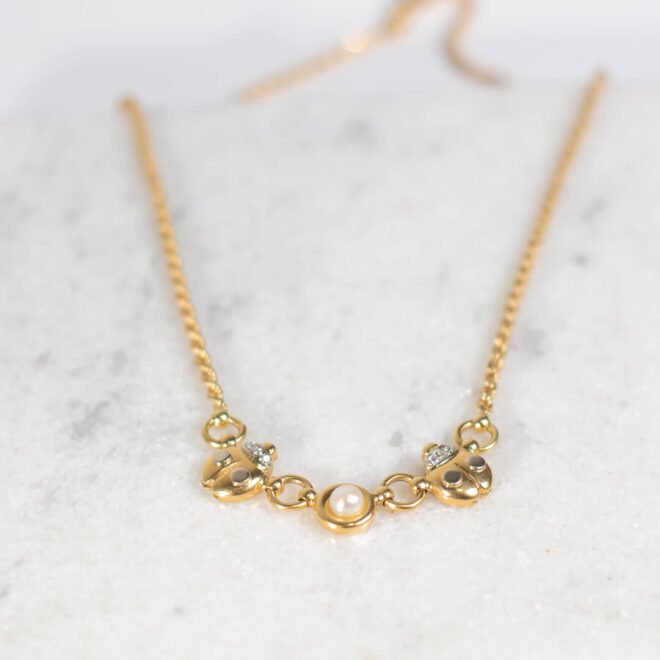 Collar de mariquitas de Oro 18k con perla central